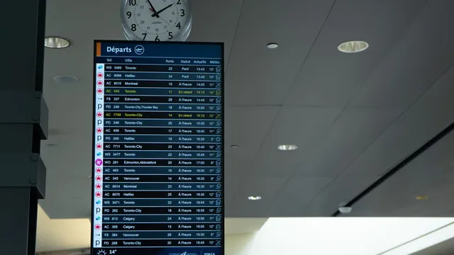 Airport departure board with several flights marked delayed in yellow