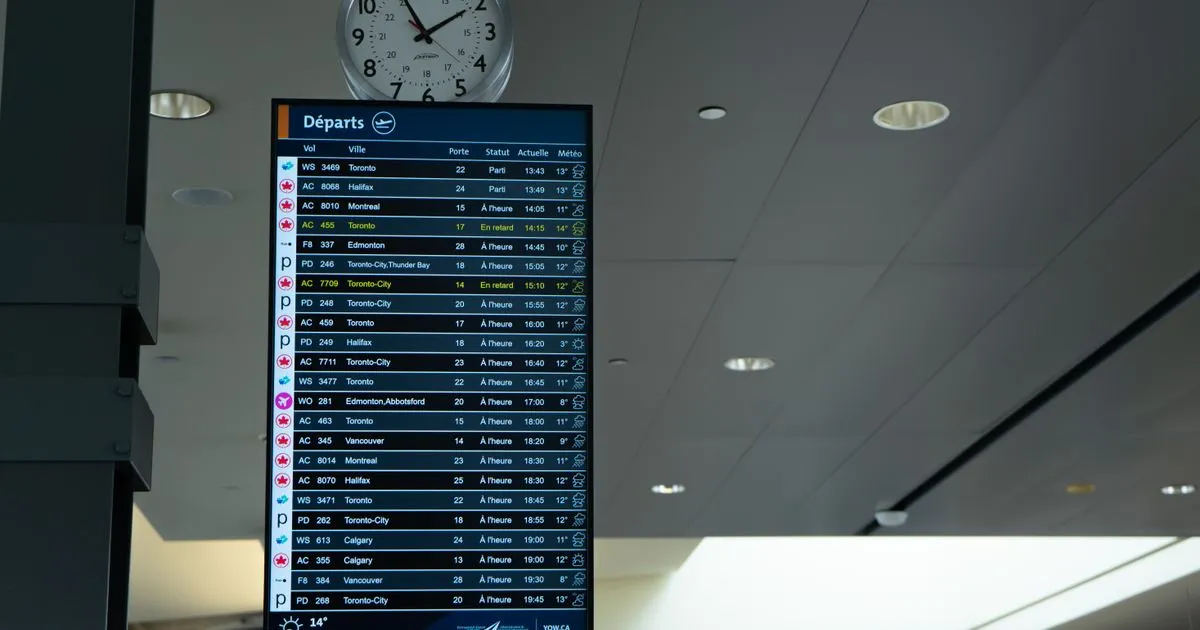 Airport departure board with several flights marked delayed in yellow